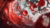 A dynamic close-up visualization of red blood cells and glucose molecules inside a human artery